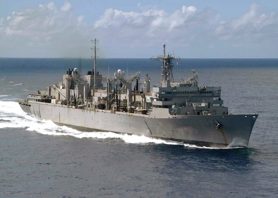 The Military Sealift Command (MSC) fast combat support ship USNS Rainier (T-AOE 7) shown underway in the Western Pacific Ocean. Rainier is part of Carrier Strike Group Nine (CSG-9), the first to be used in the Surge Role in support of the Chief of Naval Operations Fleet Response Plan.