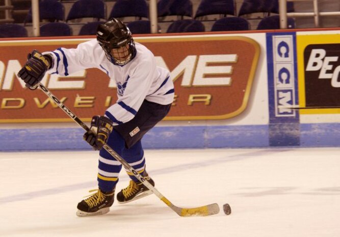 CHARLESTON, S.C. -- Lennon Davis receives a pass on his way to make a shot at the Navy's goal.  The Airmen are on the Air Force hockey team from nearby Charleston Air Force Base.  They defeated the Navy team 6-5.  (U.S. Air Force photo by Staff Sgt. Matthew Hannen)
