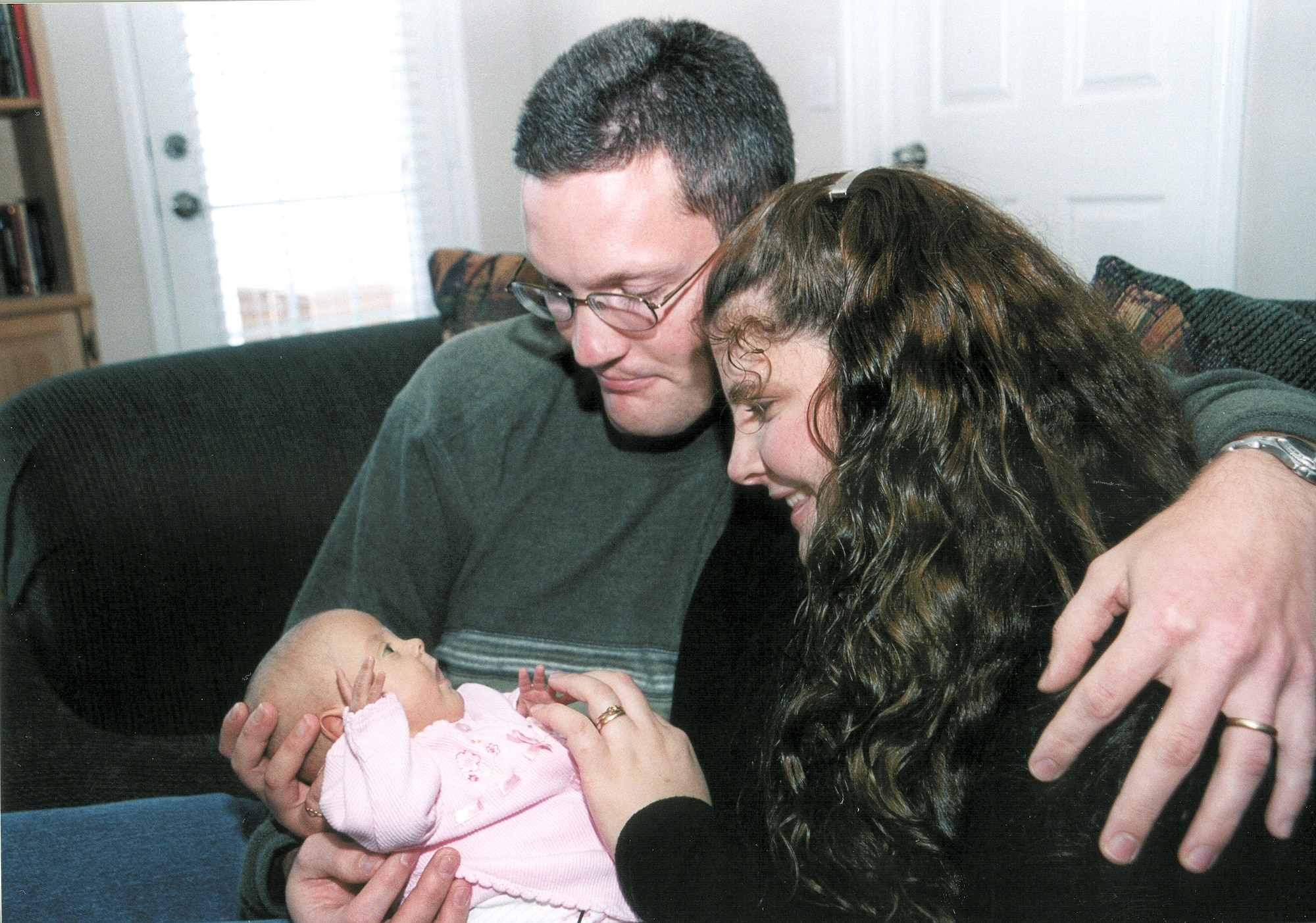 TINKER AIR FORCE BASE, Okla. -- Genevieve Faith Nash, born prematurely, will be 5 months old when she celebrates her first Christmas with her father, Staff Sgt. Gary Nash; mother, Kelley; and her four brothers.  Had she been born on schedule, she would be just 6 weeks old.  (U.S. Air Force photo by Kelly Sharp)