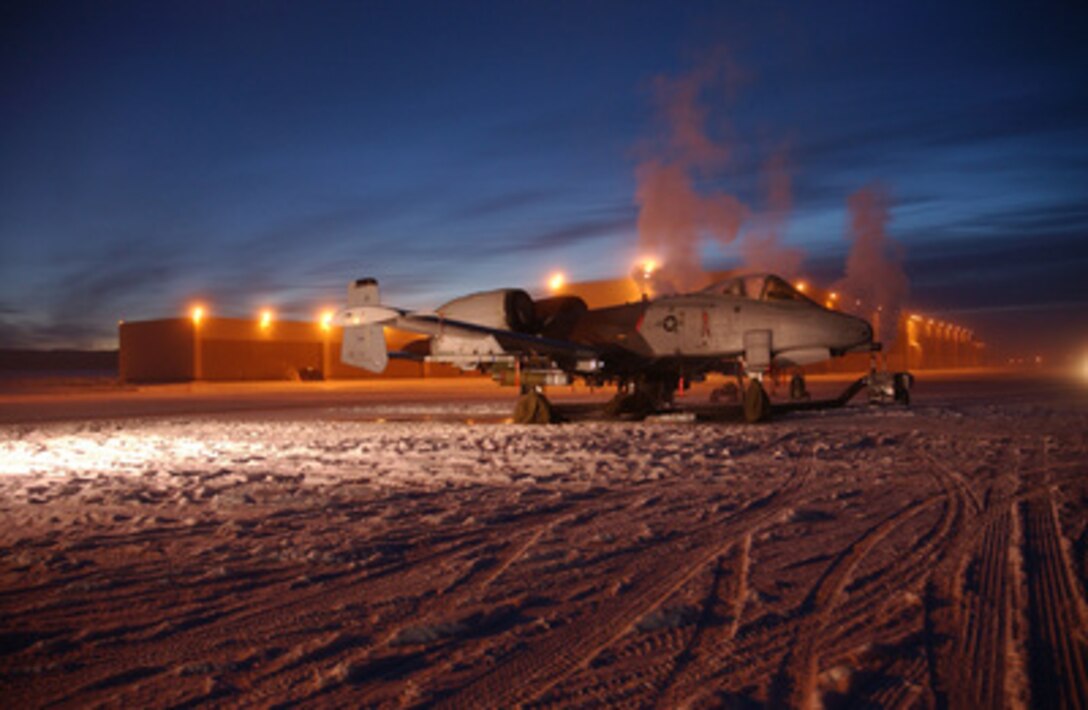 A U.S. Air Force O/A-10 Thunderbolt II is prepared for a training mission on the snow-covered parking ramp at Eielson Air Force Base, Alaska, on Dec. 21, 2004. The Thunderbolt, more commonly called a Warthog, is attached to the 355th Fighter Squadron, 354th Operations Group, 354th Fighter Wing. 