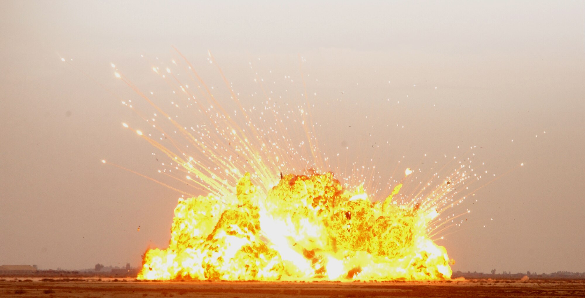 BALAD AIR BASE, Iraq -- A controlled detonation blast here lights up the sky.  Materials detonated include weapons, contaminated fuel and outdated flares.  (U.S. Air Force photo by Staff Sgt. Ryan Hansen)