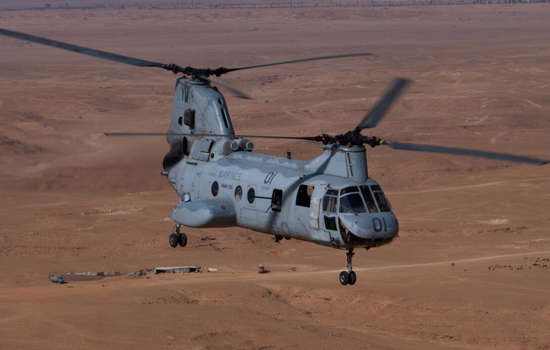 A CH-46E Sea Knight from Marine Medium Helicopter Squadron 365, Marine Aircraft Group 16, 3rd Marine Aircraft Wing, flies through the air Dec. 30 on a troop and cargo transport mission. The mission origated at Al Asad, Iraq and ended up transporting the cargo to a forward operating base near the Syrian border. The "Blue Knights" run frequent missions throughout Western Iraq to support the I Marine Expeditionary Force with troop movements and supply runs.