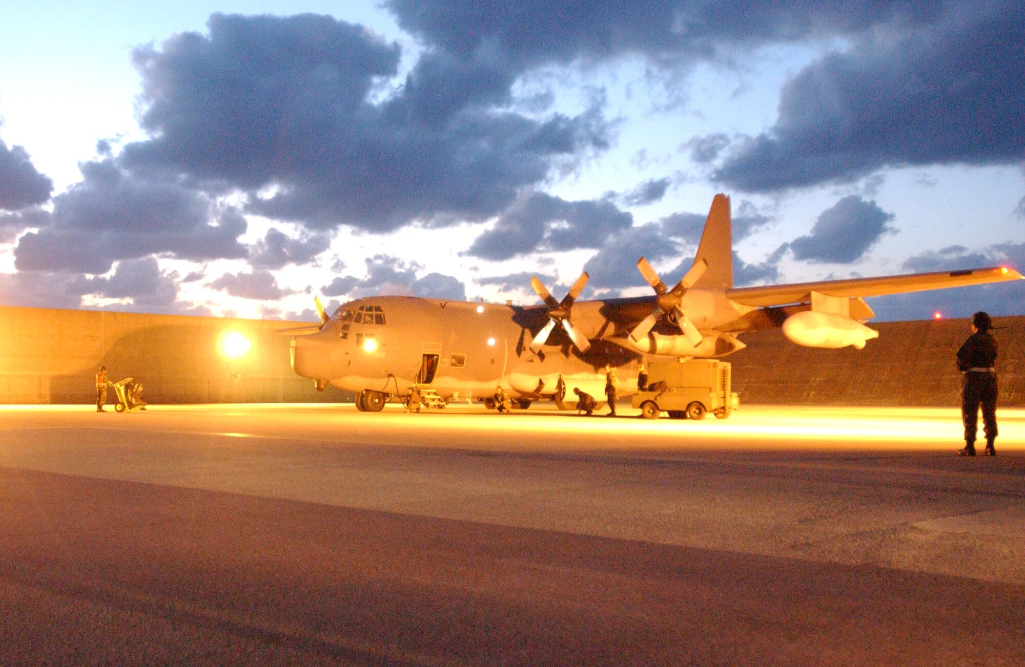 KADENA AIR BASE, Japan -- An Air Force C-130 Hercules prepares for takeoff after being loaded with two aircraft pallets of packaged meals bound for Southeast Asia as part of disaster relief following a 9.0-magnitude earthquake that struck Dec.26 off the coast of Indonesia.  The quake caused tsunami waves that have affected 12 countries and have killed more than 100,000 people.  More than 3,000 cases of meals and four aircraft pallets of fresh water were processed through the cargo area here Dec. 29.  The 18th Wing is providing relief supplies and personnel to help with the humanitarian effort.  (U.S. Air Force photo by Tech. Sgt. Richard Freeland)