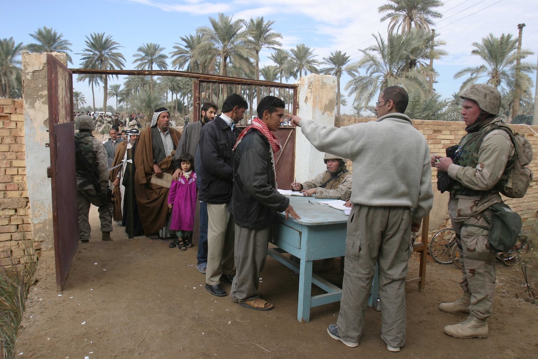 Marines and sailors of the 11th Marine Expeditionary Unit conducted their seventh humanitarian assistance event in the An Najaf and Al Qadisiyah provinces Dec. 31. They processed more than 870 Iraqis during the humanitarian assistance operation on the outskirts of the holy Shi'a city of Kufa.