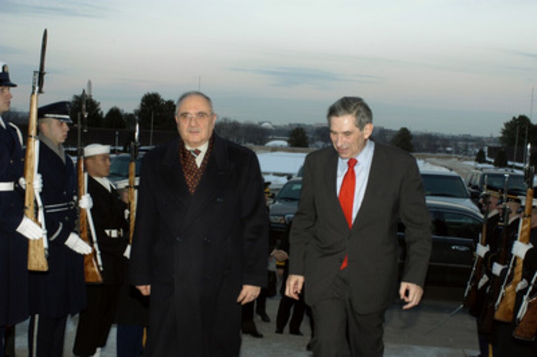 Deputy Secretary of Defense Paul Wolfowitz (right) escorts Turkish Minister of National Defense Vecdi Gonul into the Pentagon on Jan. 29, 2004. The two leaders will meet to discuss defense issues of mutual interest. 