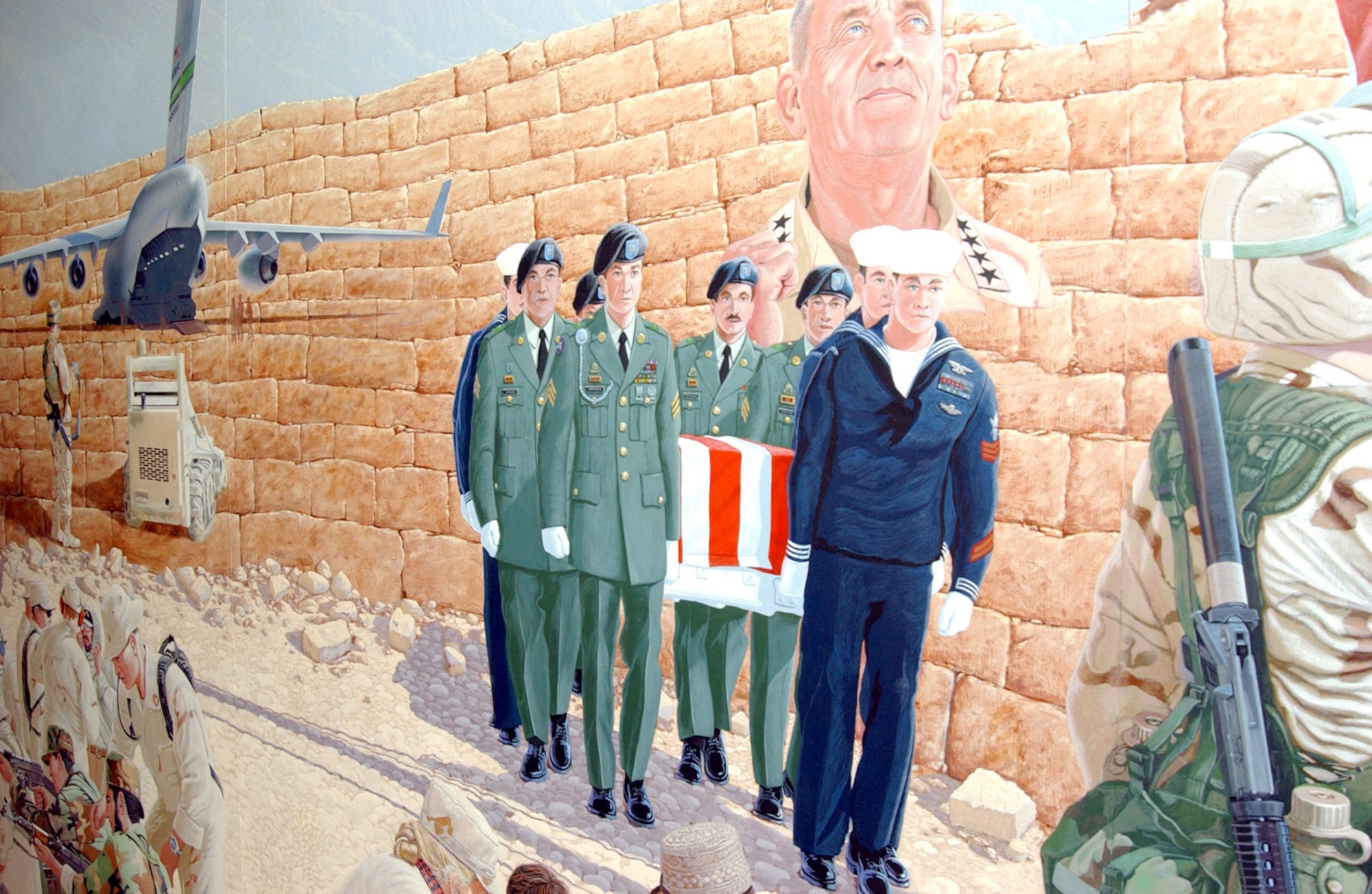 MACDILL AIR FORCE BASE, Fla. -- Artist Stewart Wavell-Smith was inspired to paint this 8-foot-tall by 28-foot-long mural to honor fallen servicemembers, portray the complex role of the U.S. military and to raise money through donations for the surviving spouses and children of fallen servicemembers.  The Enduring Freedom Mural was unveiled at the U.S. Central Command headquarters here Jan. 30.  (U.S. Air Force photo by 2nd Lt. Erin Dorrance)