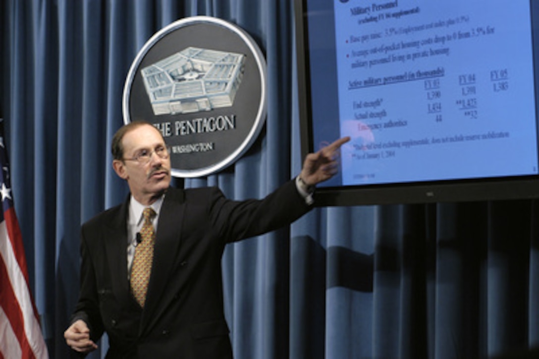 Under Secretary of Defense, Comptroller, Dov Zakheim refers to a chart as he presents the Department of Defense Fiscal 2005 budget during a Pentagon briefing on Feb. 2, 2004. 