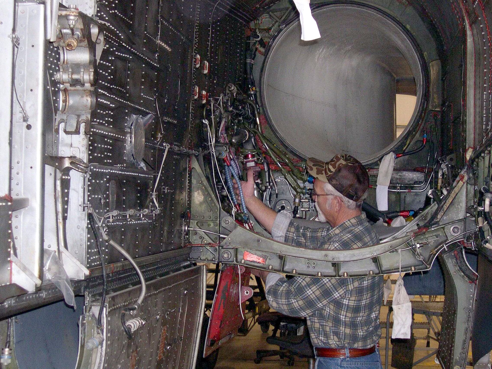 DAVIS-MONTHAN AIR FORCE BASE, Ariz. -- Steven Herman inspects work done on an F-4 being regenerated.  Mr. Herman was awarded $10,000 for saving the Air Force and the Aerospace Maintenance and Regeneration Center more than $72,000 in its first year.  He is a pneudraulics systems specialist at AMARC.  (Courtesy photo)