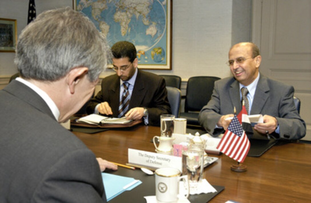 Minister of Foreign Affairs Abu Bakr al-Qirbi (right), of Yemen, meets with Deputy Secretary of Defense Paul Wolfowitz (foreground) in the Pentagon on Feb. 4, 2004. A range of bilateral security issues, including some relating to the global war on terrorism, were on the table for discussion. 
