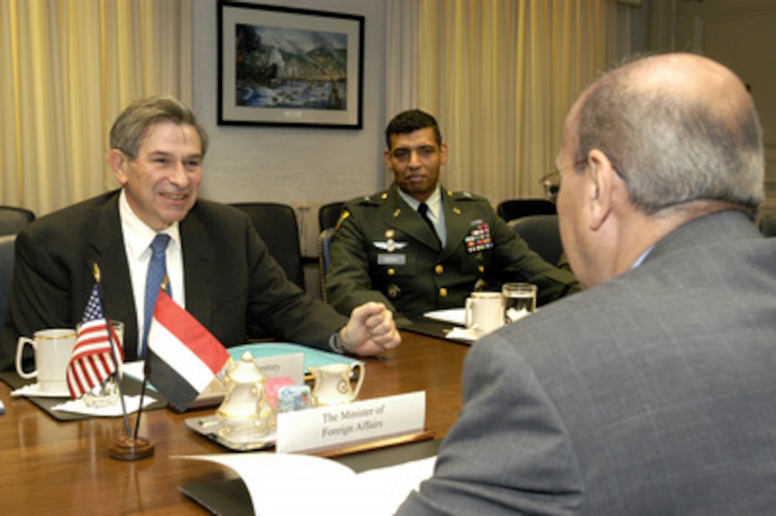Deputy Secretary of Defense Paul Wolfowitz (left) hosts a Pentagon meeting with Yemen's Minister of Foreign Affairs Abu Bakr al-Qirbi (foreground) on Feb. 4, 2004. A range of bilateral security issues, including those relating to the global war on terrorism, were expected to be discussed. Among those participating in the talks is U.S. Army Brig. Gen. Vincent Brooks (center), who is deputy director for the war on terrorism, on the Joint Staff. 