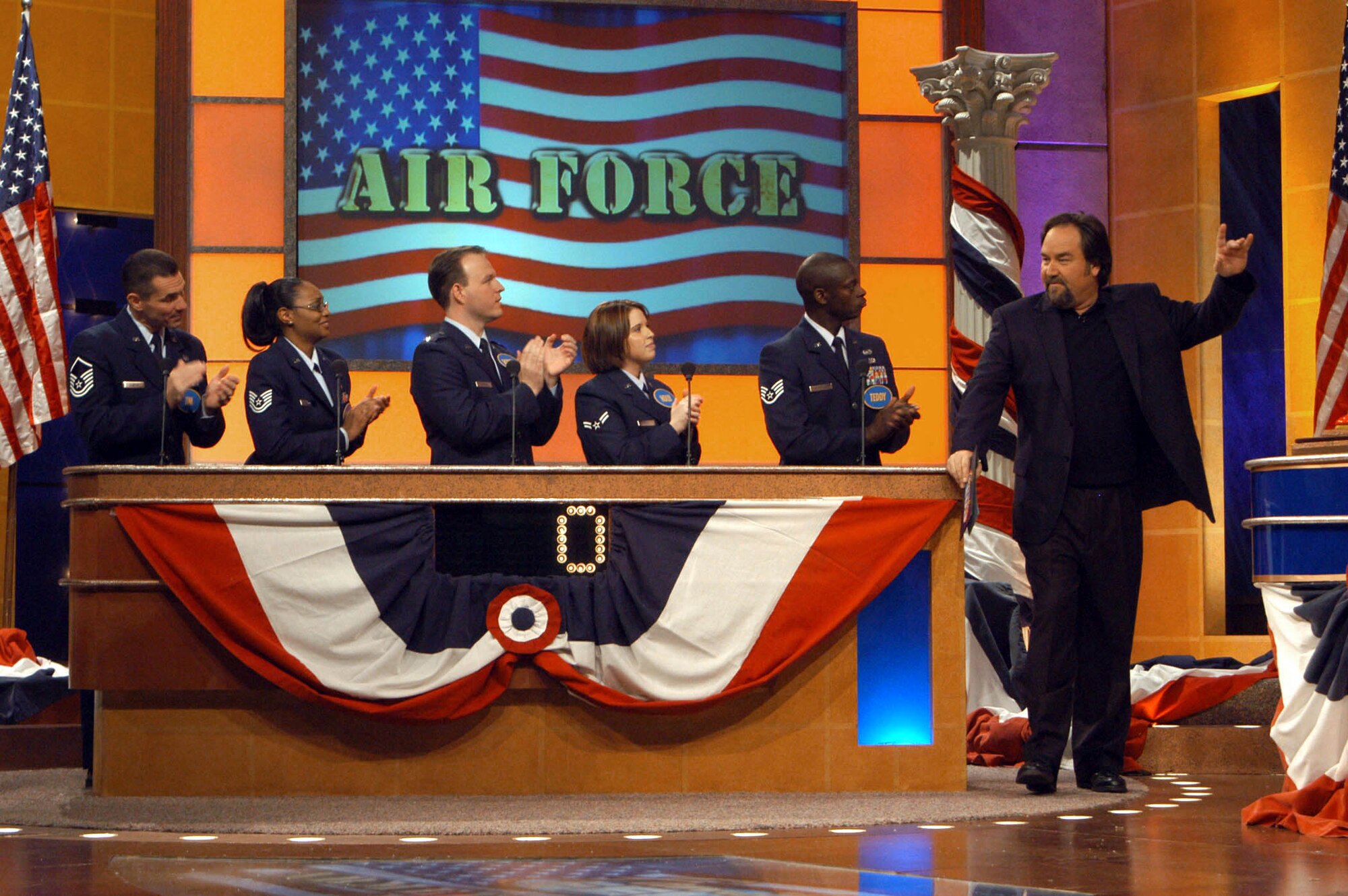 LOS ANGELES -- (From left) Master Sgt. Jim Gantar, Tech. Sgt. Daphne Soto, Capt. Robert Wagner, Airman 1st Class Holly Frost, Staff Sgt. Teddy Deshazier and host Richard Karn tape an episode of "Family Feud" here Jan. 31.  (U.S. Air Force photo by Airman 1st Class Matthew Dillier)
