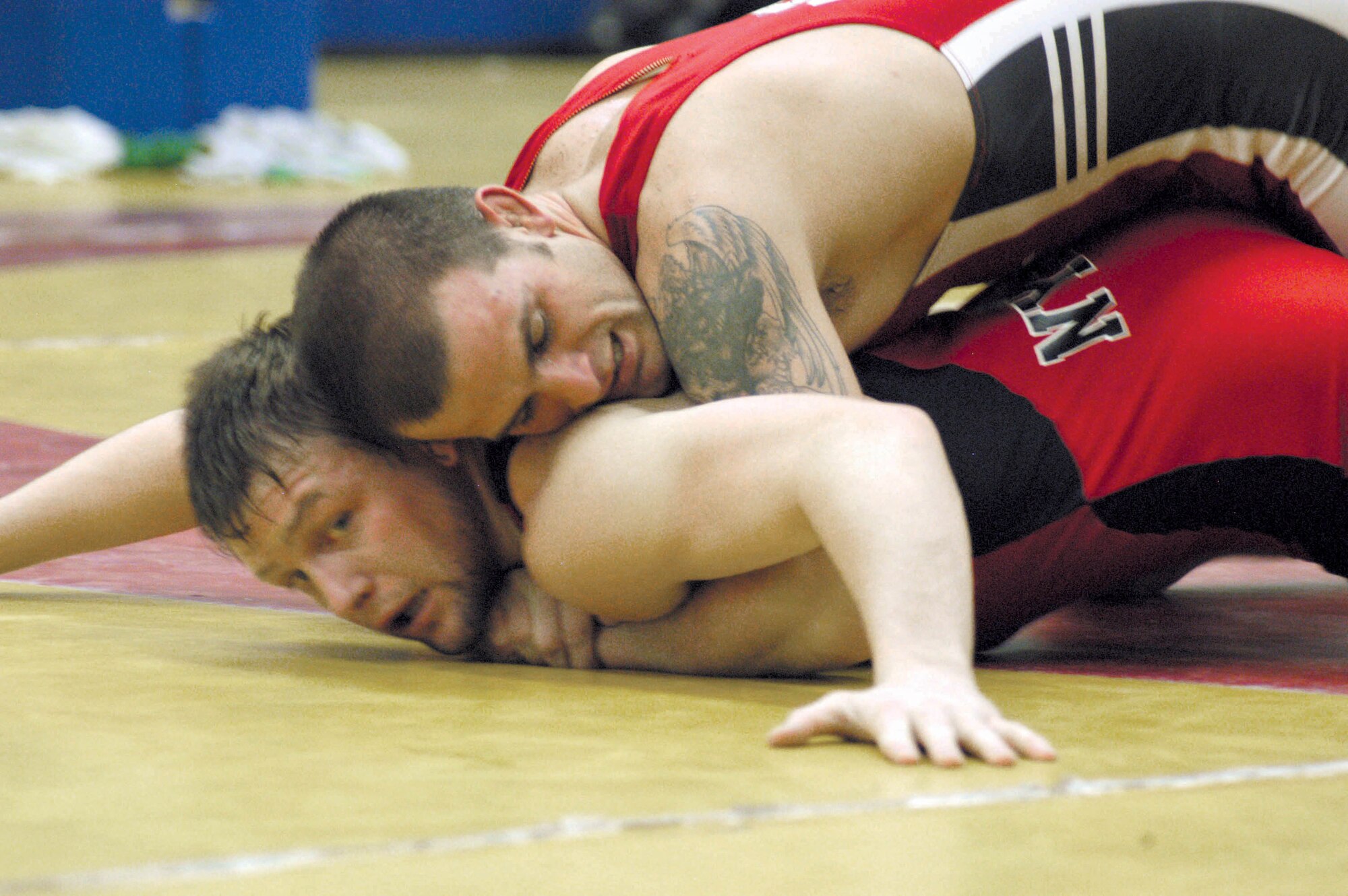 COLORADO SPRINGS Colo. -- Jacob Hey tries to score a point on Joe Warren during a wrestling practice session at the Olympic Training Center here recently.  Hey is a Greco-Roman wrestler and member of the All-Air Force Wrestling Team.  He is vying for a spot on the 2004 U.S. Olympic team.  Warren represents the New York Athletic Club.  (Courtesy photo)