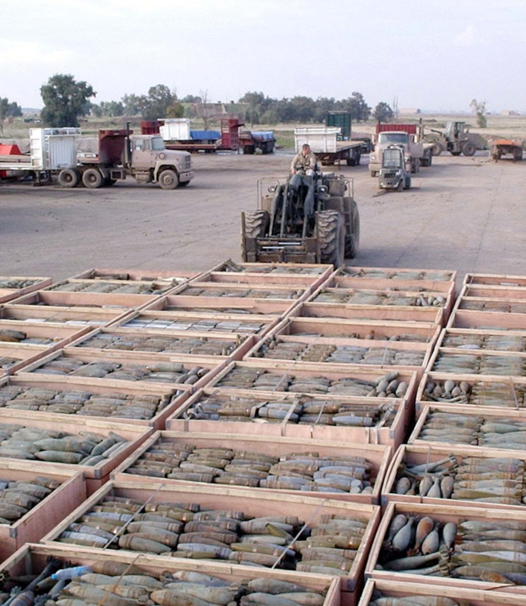 KIRKUK AIR BASE, Iraq -- Senior Airman Edward Stottlmyer unloads munitions from a weapons cache during a massive clean-up of a rundown weapons storage area.  Airman Stottlmyer is assigned to the 355th Expeditionary Maintenance Squadron's muntions flight.  (U.S. Air Force photo by Senior Master Sgt. Eugene Ladoucer)