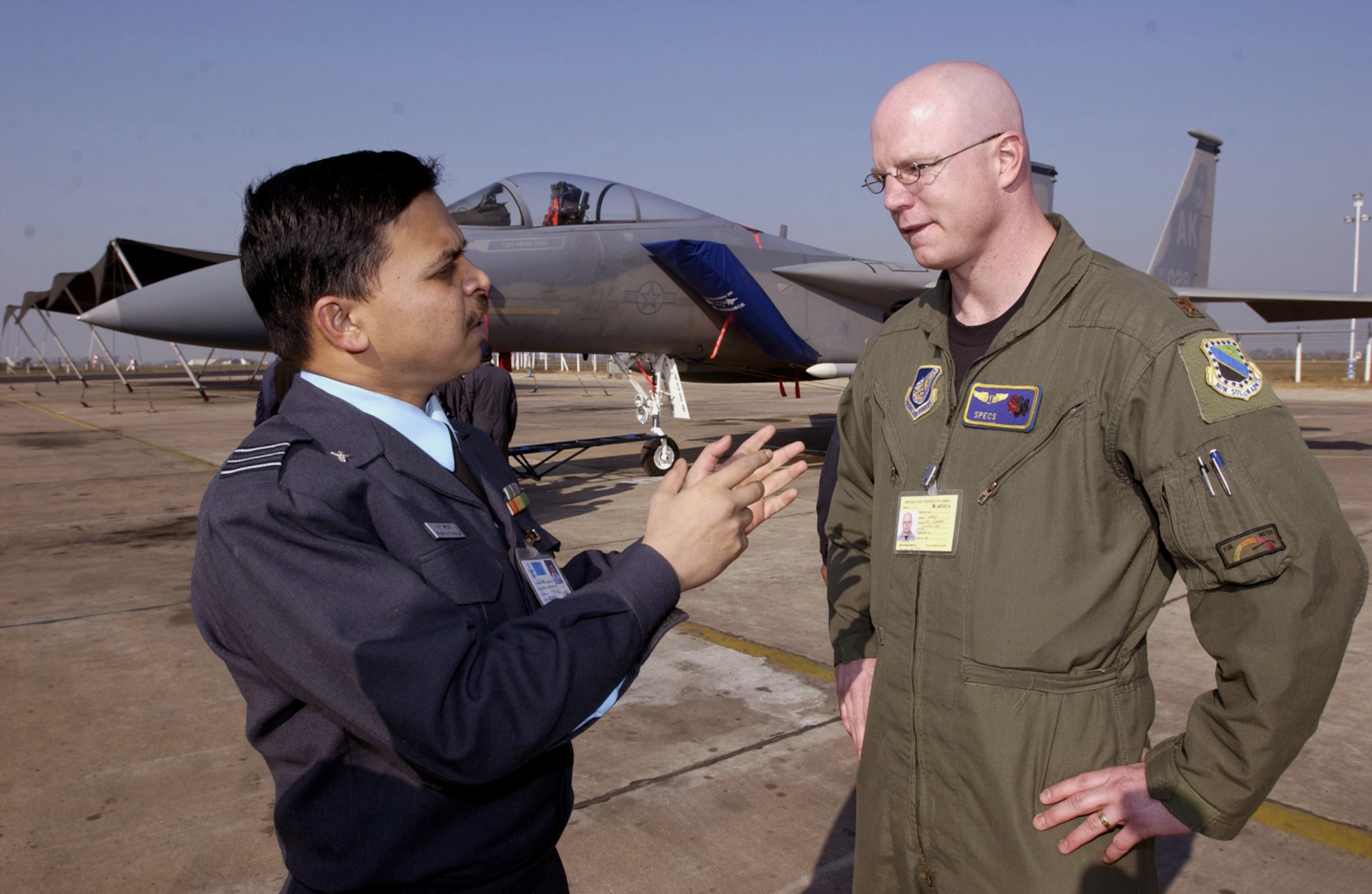 GWALIOR AIR FORCE STATION, India (AFPN) -- Squadron Leader (Dr.) M.S. Nataraja (left) discusses medical issues with Maj. (Dr.) Tim McGraw here.  Both doctors are participating in Cope India 04, a bilateral fighter training exercise between the American and Indian air forces.  Aircraft and approximately 150 airmen from Elmendorf Air Force Base, Alaska, are deployed for the exercise. (U.S. Air Force photo by Tech Sgt. Keith Brown)