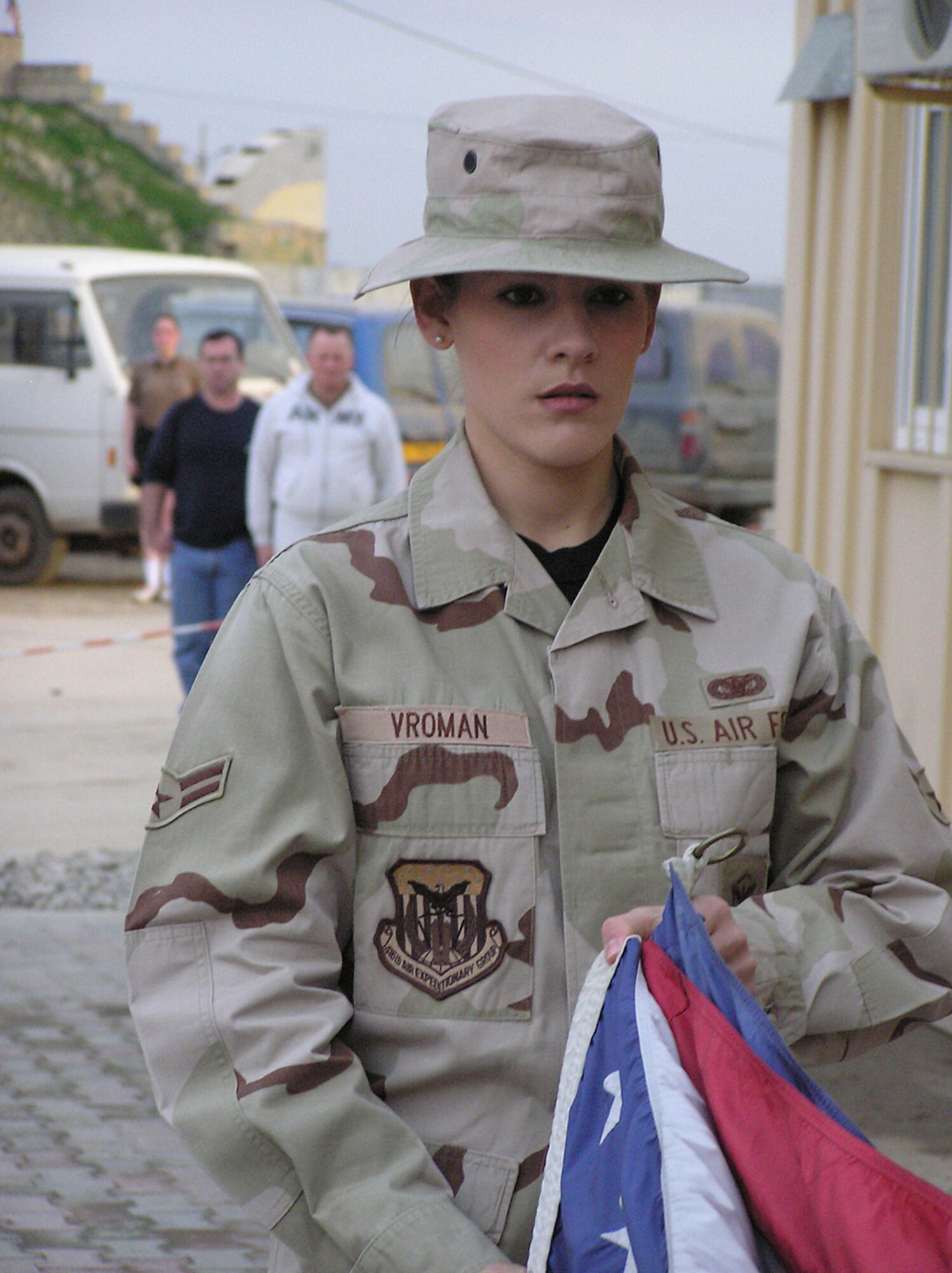 OPERATION ENDURING FREEDOM -- Shortly before her promotion to senior airman this month, Laurie Vroman leads an honor guard team in a formal retreat ceremony at a forward-deployed location.  Airman Vroman is a security forces journeyman with the 455th Air Expeditionary Wing and is deployed from Fairchild Air Force Base, Wash.  (U.S. Air Force photo by Tech. Sgt. Brian Davidson)