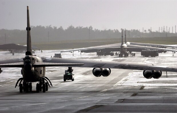 ANDERSEN AIR FORCE BASE, Guam -- The first of six B-52 Stratofortresses taxis to its parking spot here after landing Feb. 22.  The B-52s and about 300 people from Minot Air Force Base, N.D., are deploying here to support U.S. Pacific Command's request for a rotational bomber force on Guam.  (U.S. Air Force photo by Staff Sgt. Bennie J. Davis III)