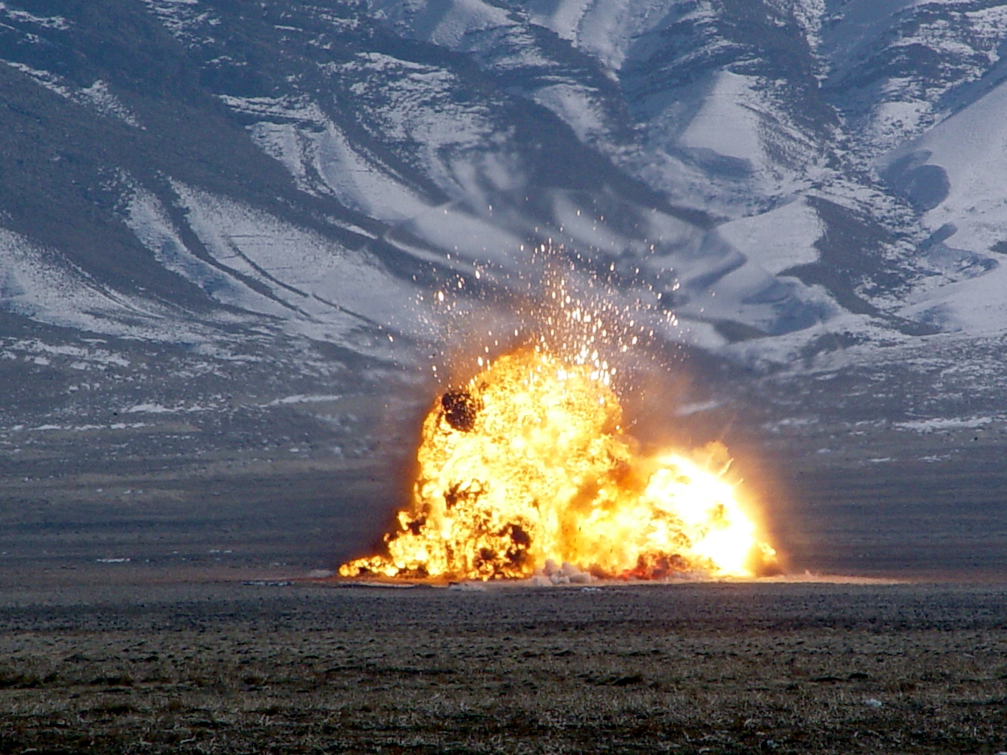 BAGRAM AIR BASE, Afghanistan -- Hundreds of Taliban weapons found by agents from the Air Force Office of Special Investigations' anti-terrorism specialty team are destroyed in a controlled explosion.  The team is deployed from OSI Detachment 252 at Lackland Air Force Base, Texas.  (U.S. Air Force photo by Senior Airman Marci Boozer)