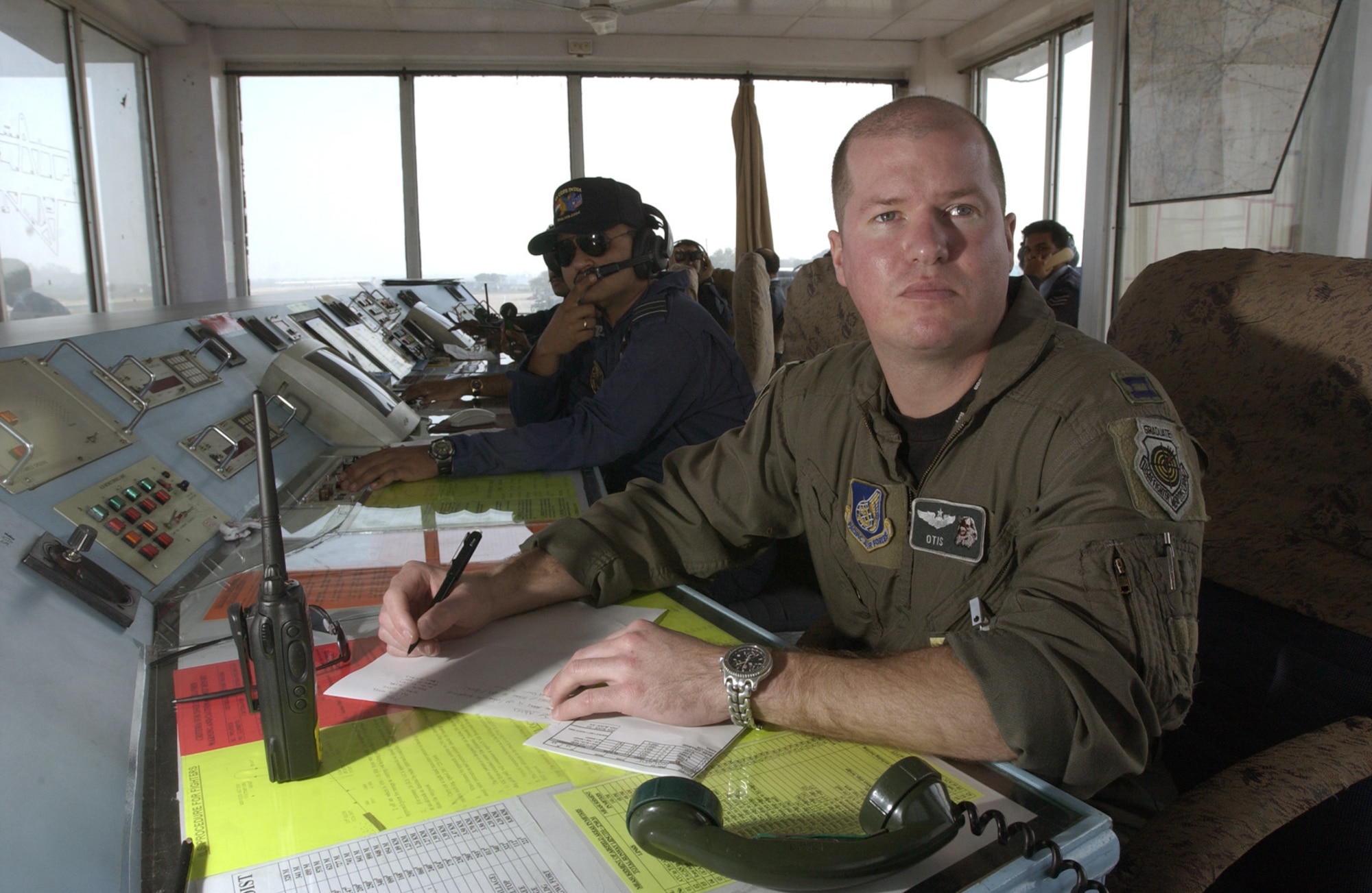GWALIOR AIR FORCE STATION, India -- Capt. Mark Snowden performs flight safety duties in the control tower here during Cope India '04.  The bilateral fighter exercise between Indian and U.S. air forces is the first of its kind in more than 40 years.  Captain Snowden is an F-15 Eagle pilot from Elmendorf Air Force Base, Alaska.  (U.S. Air Force photo by Tech. Sgt. Keith Brown)