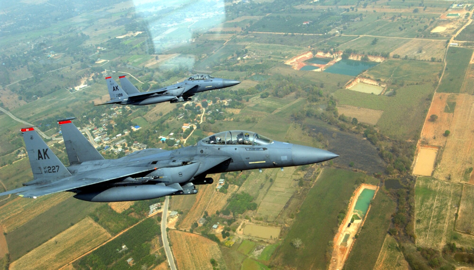 KORAT ROYAL AIR FORCE BASE, Thailand -- Two F-15E Strike Eagles from the 90th Fighter Squadron at Elmendorf Air Force Base, Alaska, fly in a Cope Tiger '04 exercise mission.  Strike Eagles are participating for the first time in the 10-year history of the exercise.  (U.S. Air Force photo by Tech. Sgt. Lee Harshman)