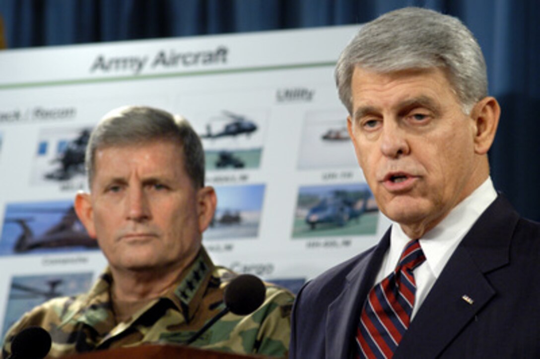 Acting Secretary of the Army Les Brownlee (right) and Army Chief of Staff Gen. Peter J. Schoomaker (left) announce the restructuring of Army aviation during a Pentagon press briefing on Feb. 23, 2004. The changes announced come in response to an ongoing, comprehensive, review of Army aviation and will be achieved partially at the expense of the decade-old Comanche helicopter program, which will be terminated. The two Army leaders emphasized that much of the advanced technology of the Comanche will be incorporated in the latest model Apache attack helicopter, which will be a key element of the new aviation units. 