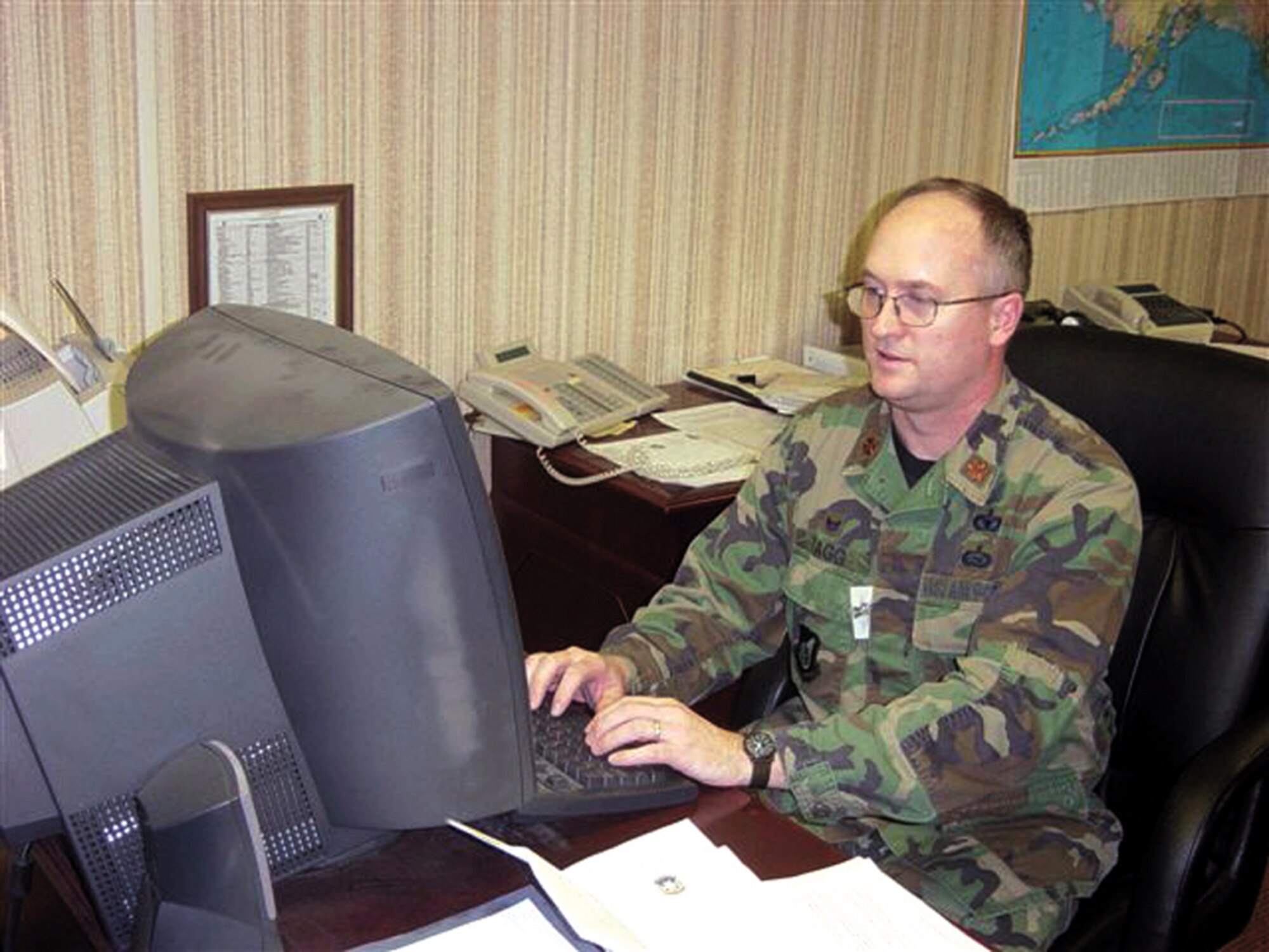 ELMENDORF AIR FORCE BASE, Alaska -- Maj. Scott Tagg checks the daily blotter from his office.  Major Tagg is an individual mobilization augmentee, a Reserve officer matched against the commander position for the 3rd Security Forces Squadron.  When the active-duty servicemember is deployed or temporarily away, an IMA can step in to backfill that position to ensure the unit continues operating normally.  (U.S. Air Force photo by Senior Airman Austin May)
