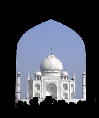 AGRA, India -- Seeing the Taj Mahal in all its glory, U.S. airmen enter through one of the monument's gates Feb. 21, during a break from Cope India '04.  About 130 airmen from Elmendorf Air Force Base, Alaska, are here for the bilateral dissimilar air combat exercise with the Indian air force.  (U.S. Air Force photo by Tech. Sgt. Keith Brown)