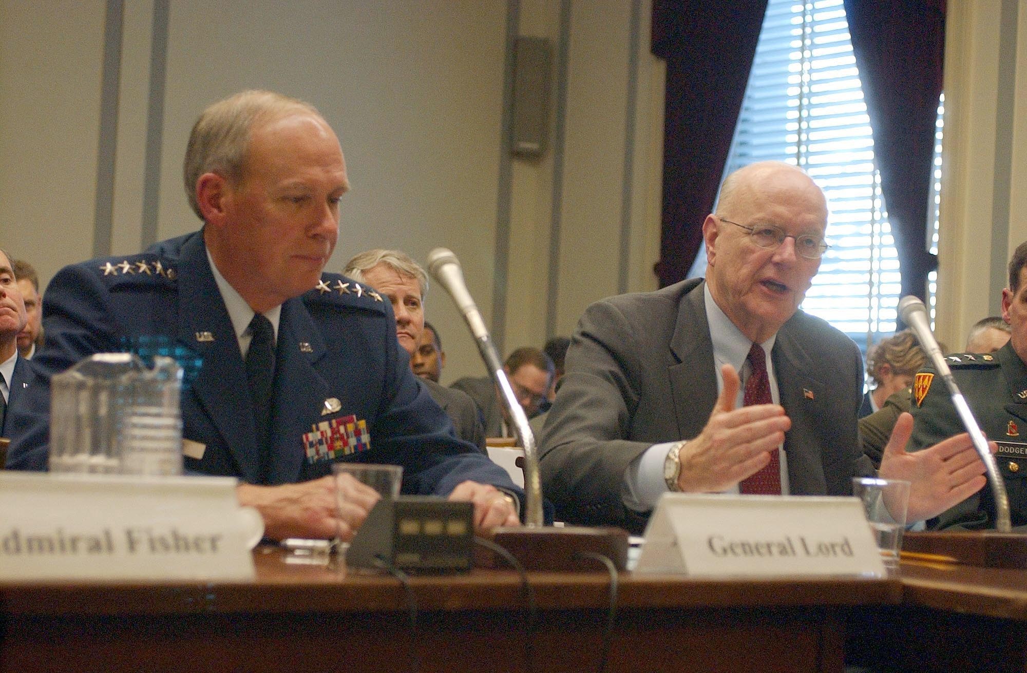 WASHINGTON -- Gen. Lance Lord (left), commander of Air Force Space Command, and Peter B. Teets, undersecretary of the Air Force and director of the National Reconnaissance Office, testified at the House Armed Services Committee subcommittee on strategic forces.  Mr. Teets outlined his five priorities for the national space effort in 2004. (U.S. Air Force photo by Master Sgt. Gary R. Coppage)