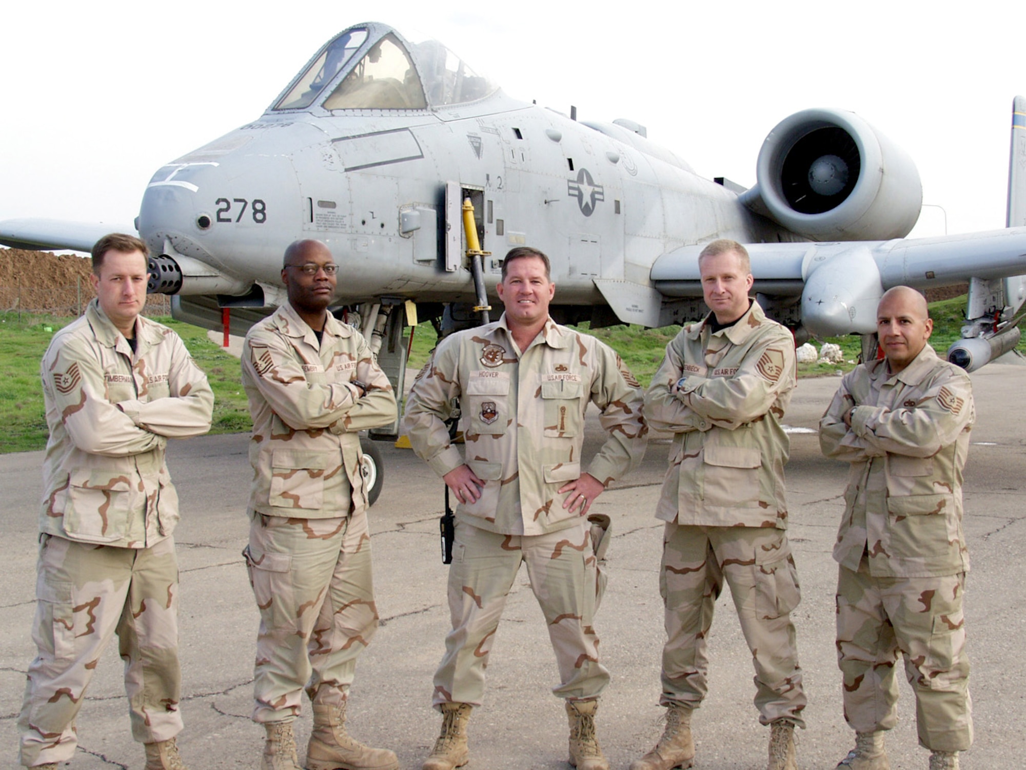 KIRKUK AIR BASE, Iraq -- From left, Tech. Sgt. Edward Timberman, Master Sgt. Elbert Bembry, Senior Master Sgt. Benjamin Hoover, Master Sgt. Darrell Wiedenbeck and Tech. Sgt. Steven Sepeda stand near an A-10 Thunderbolt II here.  The five A-10 maintainers served in both operations Desert Storm and Iraqi Freedom during their careers.  (U.S. Air Force photo by Tech. Sgt. Jeffrey Williams)