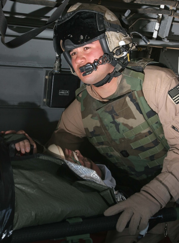 Petty Officer 3rd Class Arthur Leal, a corpsman with II Marine Expeditionary Force causality evacuation serving at Al Taquadum, Iraq, watches as a wounded U.S. service member holds on to life during an urgent casevac from the city of Ramadi, Iraq. Leal, a League City, Texas, native, has gone through extensive casevac training, preparing him for any challenge he may face while deployed.