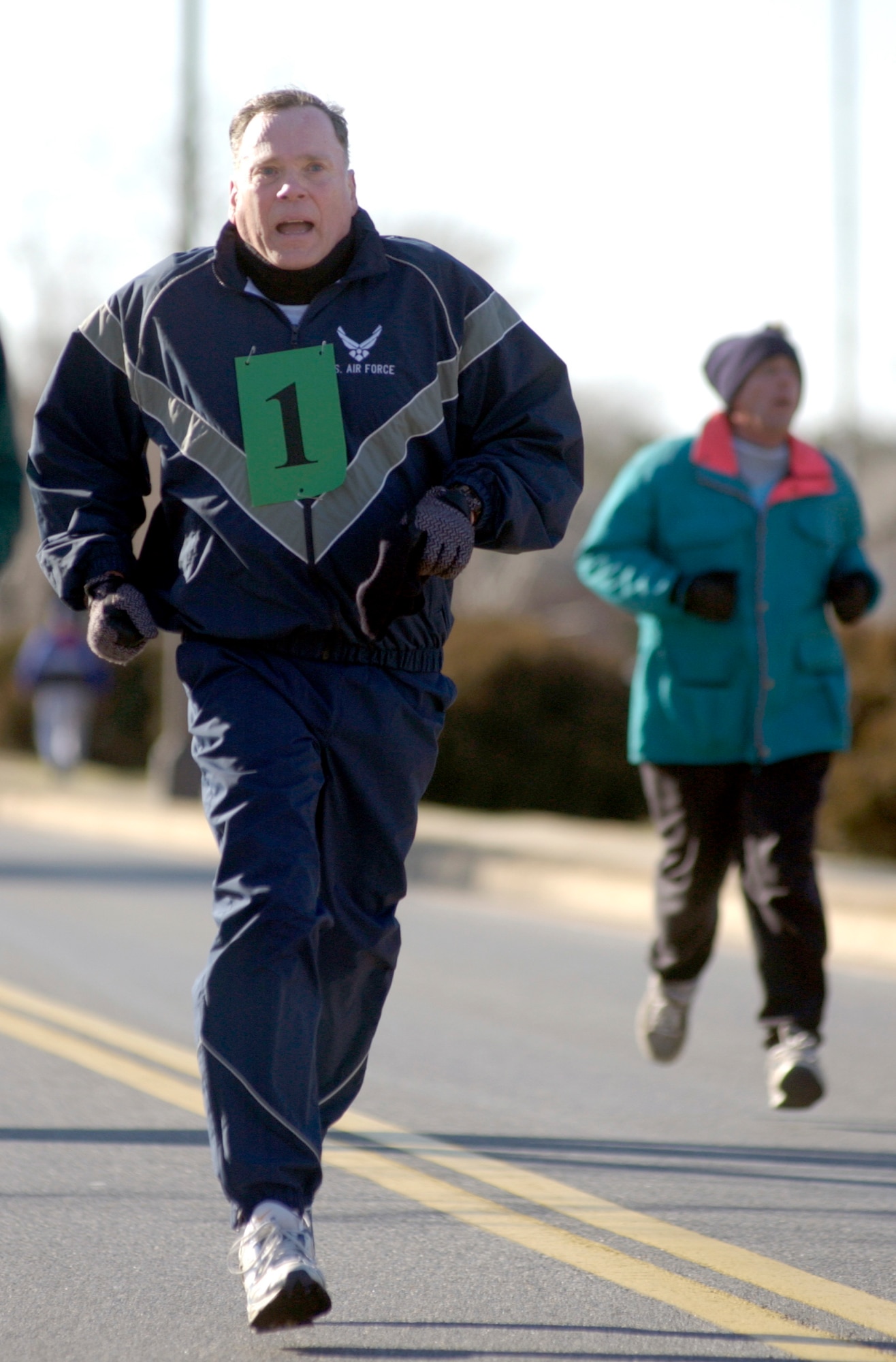 BOLLING AIR FORCE BASE, D.C. (AFPN) -- Air Force Chief of Staff Gen. John P. Jumper finishes the 1.5-mile run for his fitness evaluation Jan. 7.  Nearly 60 general officers from throughout the National Capitol Region braved bitter cold weather to join General Jumper as he led the way in officially launching the new Air Force fitness standard.  (U.S. Air Force photo by Master Sgt. Jim Varhegyi)