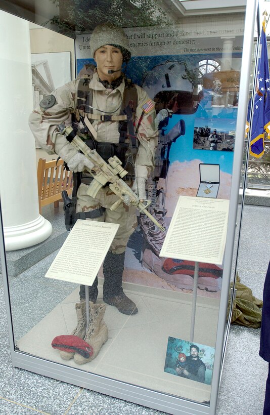 WASHINGTON -- Air Force Secretary Dr. James G. Roche unveiled a memorial at Arlington National Cemetery on Jan.8 to honor Tech. Sgt. John A. Chapman who was killed March 4, 2002, while fighting against the Taliban during Operation Anaconda in Afghanistan.  He was posthumously decorated with the nation's second-highest award for valor, the Air Force Cross.  (U.S. Air Force photo by Master Sgt. Jim Varhegyi)