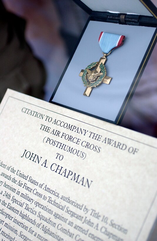 WASHINGTON -- Air Force Secretary Dr. James G. Roche unveiled a memorial at Arlington National Cemetery on Jan.8 to honor Tech. Sgt. John A. Chapman who was killed March 4, 2002, while fighting against the Taliban during Operation Anaconda in Afghanistan.  He was posthumously decorated with the nation's second-highest award for valor, the Air Force Cross.  (U.S. Air Force photo by Master Sgt. Jim Varhegyi)