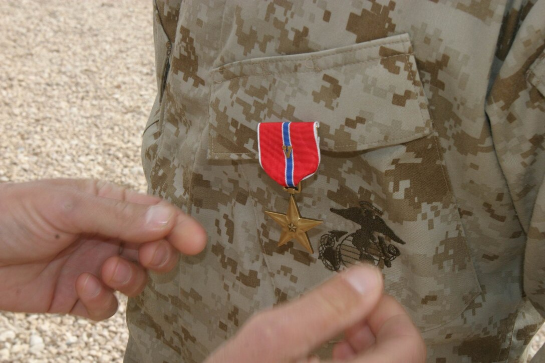 Staff Sergeant Robert W. Willis Jr., platoon sergeant, 1st Platoon, Company B, Battalion Landing Team 1st Battalion, 4th Marine Regiment, 11th Marine Expeditionary Unit (Special Operations Capable), was awarded the Bronze Star medal during an awards ceremony at Forward Operating Base Hotel, Iraq, Dec. 12. "It was my honor to present him with (the Bronze Star) and I'm so proud that he's in BLT 1/4. He makes all of us proud," Mayer continued. "He is truly a man among men and a hero among all of us. Congratulations -- well deserved. What a monumental achievement."