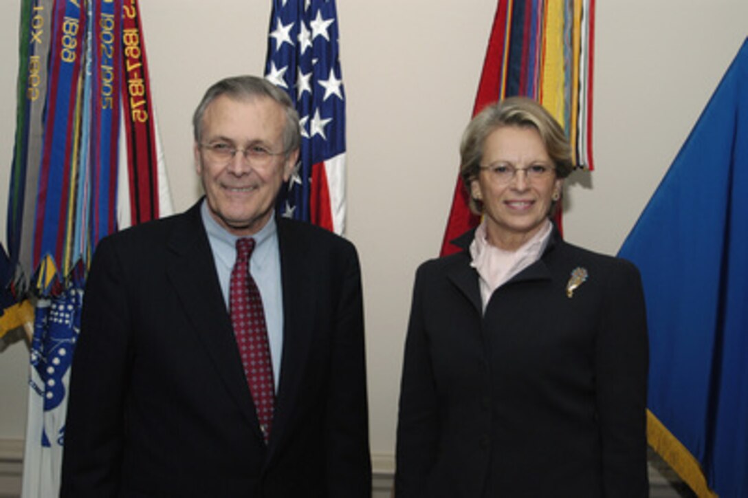 Secretary of Defense Donald H. Rumsfeld and French Minister of Defense Michelle Alliot-Marie pose for photographers prior to their meeting in the Pentagon on Jan. 15, 2004. The two leaders are meeting to discuss defense issues of mutual interest. 