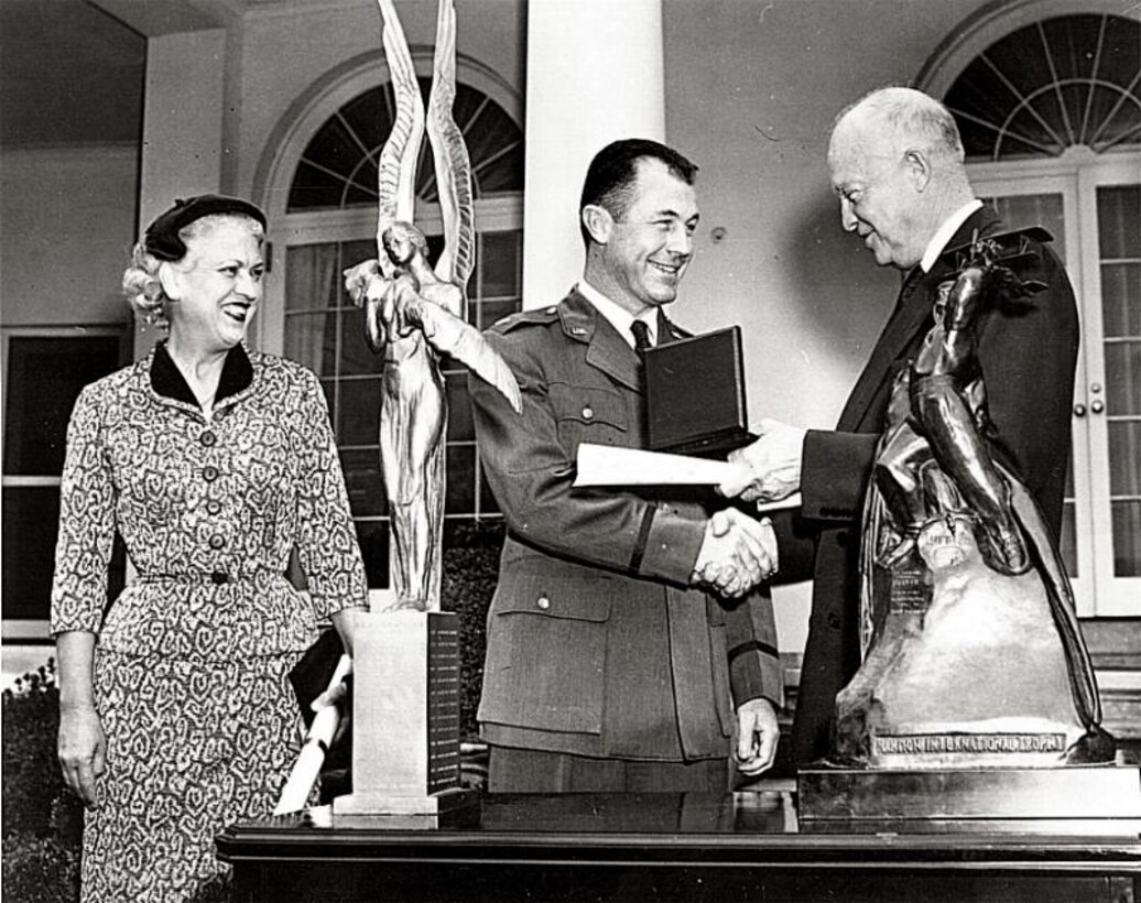 Jackie Cochran and Chuck Yeager being presented with the Harmon International Trophies by President Dwight D. Eisenhower. (Photo courtesy Air Force Flight Test Center History Office)