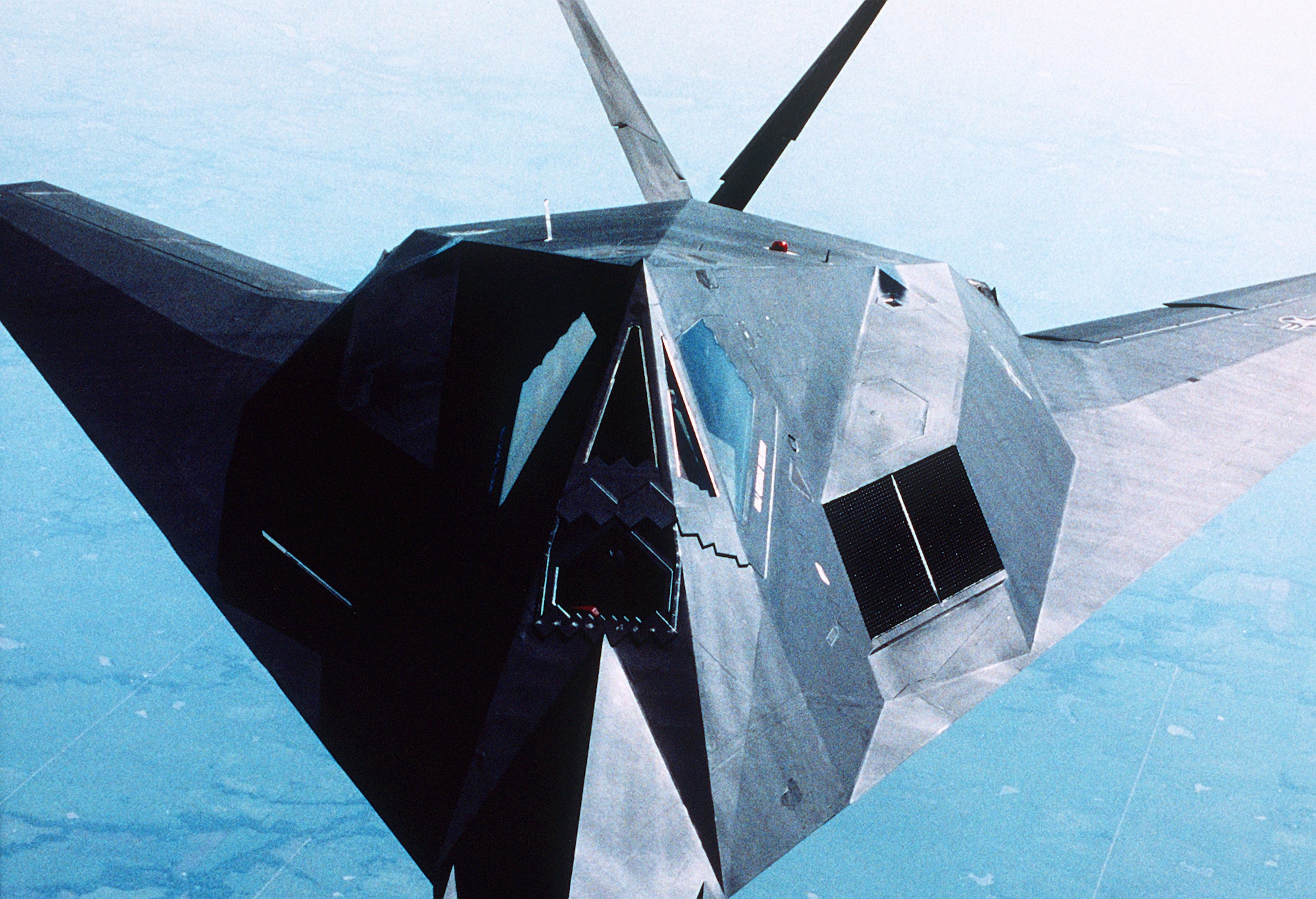 1990's -- An F-117A aircraft from the 37th Tactical Fighter Wing (37th TFW) moves in for a midair refueling during Operation Desert Shield.  