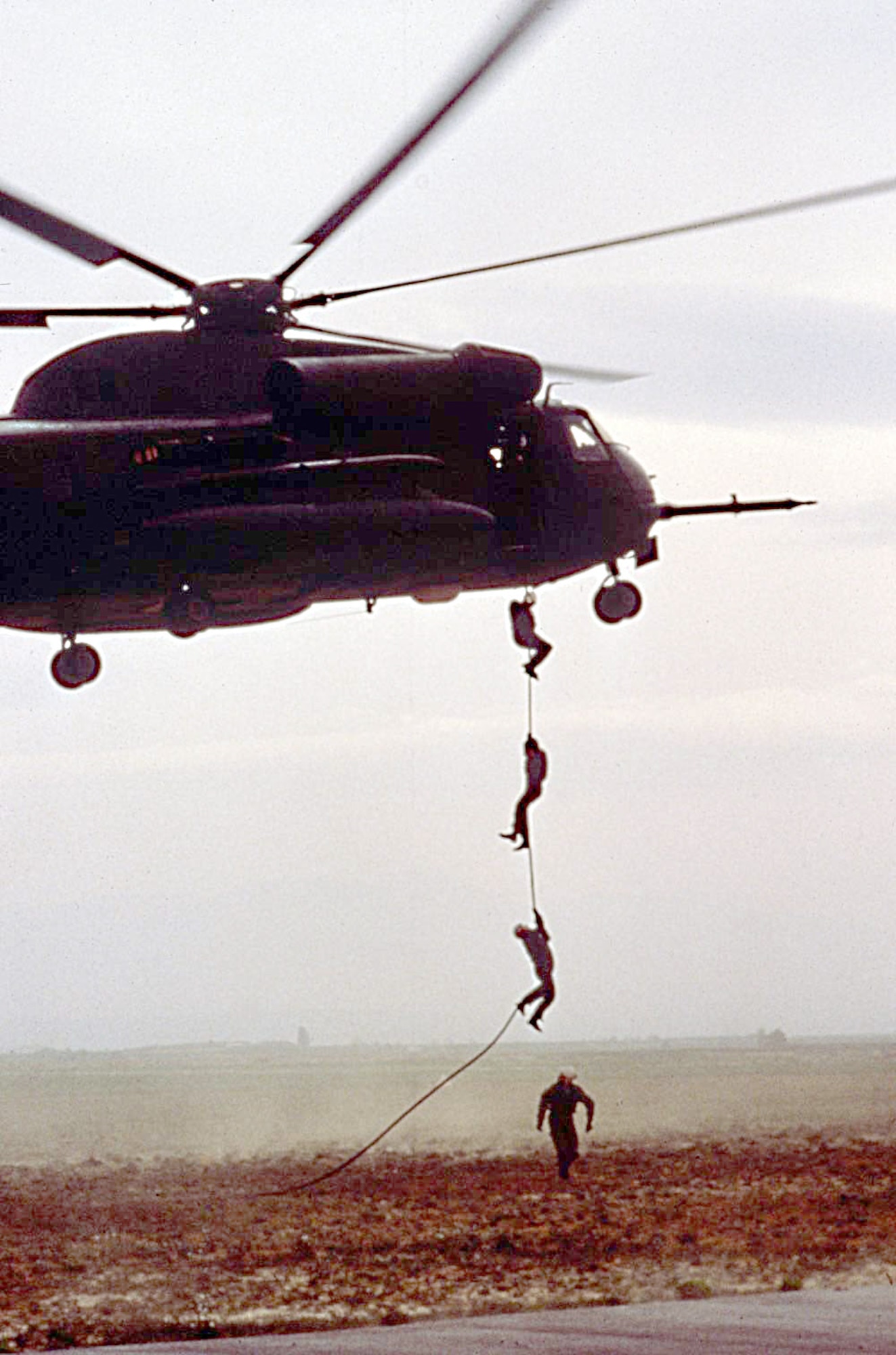 Pararescuemen do a "fast rope" from a hovering HH-53, used extensively during the Vietnam War for rescue of combat personnel. (U.S. Air Force photo by Master Sgt. Dave Nolan)