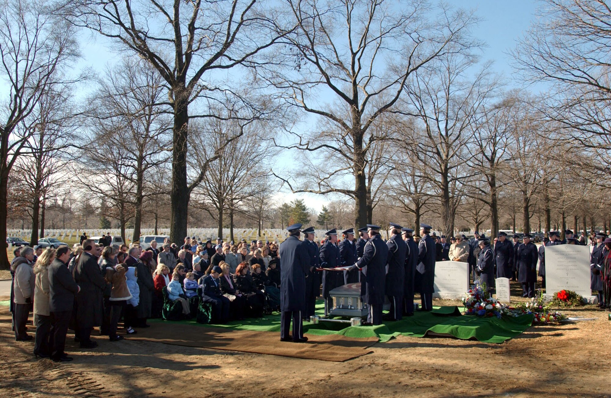 ARLINGTON, Va. -- Air Force Honor Guard pallbearers fold a flag over the remains of one of the military members who were killed when their MH-53M Pave Low helicopter crashed Nov. 23 in Afghanistan.  A full-honor mass funeral was held at Arlington National Cemetery on Jan. 21.  (U.S. Air Force photo by Staff Sgt.  Jennifer Gangemi)