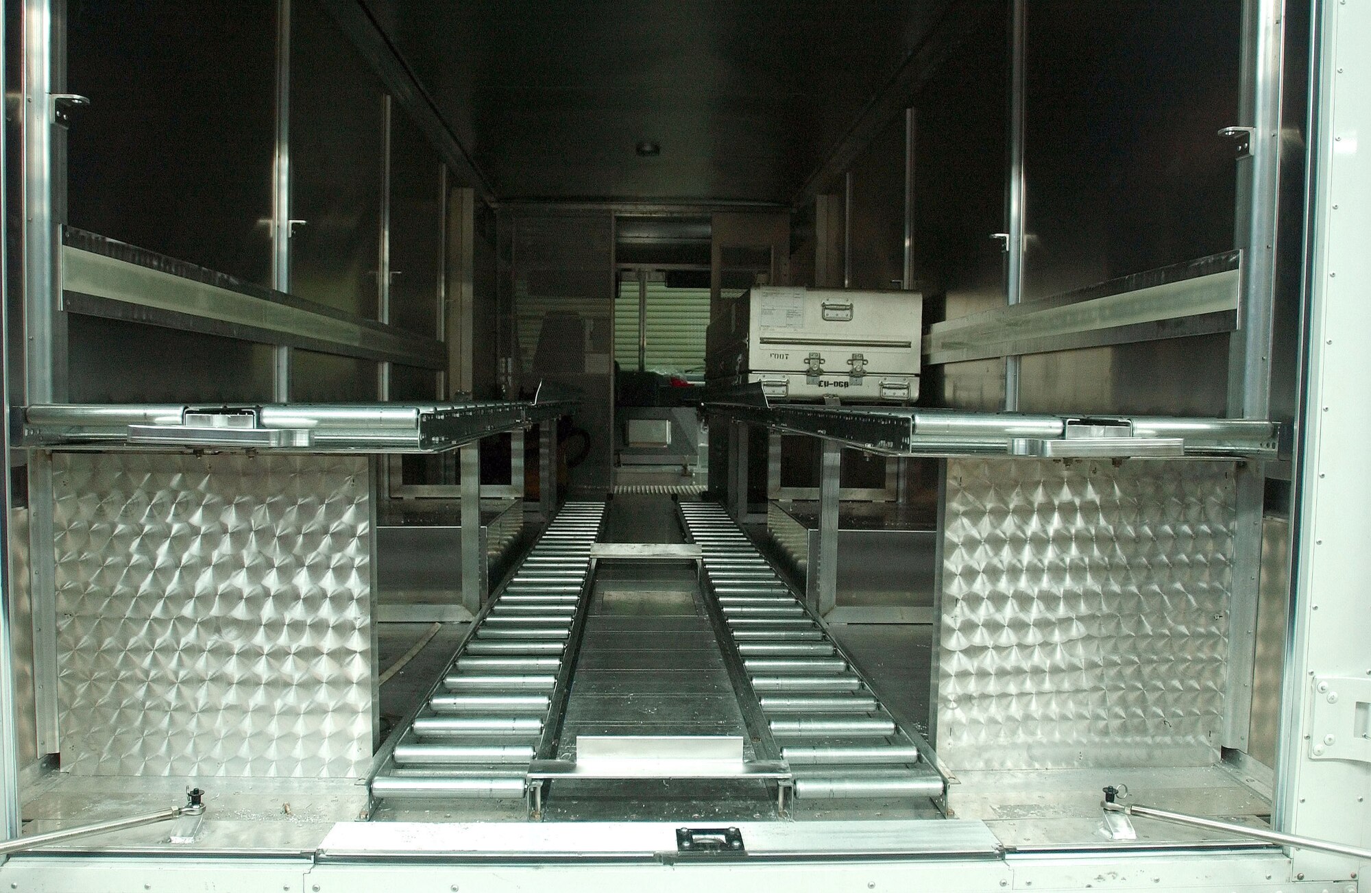 DOVER AIR FORCE BASE, Del. -- Airmen from the 436th Equipment Maintenance Squadron fabrication flight here redesigned a mortuary vehicle to increase the capacity from two transfer cases to six.  (U.S. Air Force photo by William M. Plate Jr.)