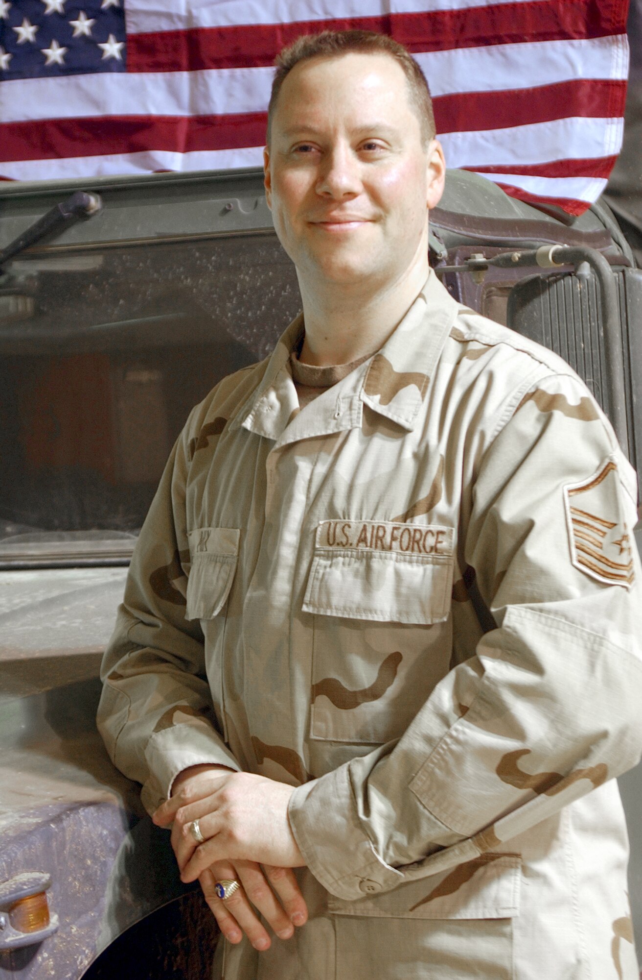 KARSHI-KHANBAD AIRFIELD, Uzbekistan -- Master Sgt. Dennis Mix developed a computer tool, called Spiderman, that allows commanders to accurately track and report all airmen assigned to, and passing through, the base.  Sergeant Mix is the personnel flight team chief with the 416th Air Expeditionary Wing and is deployed from McChord Air Force Base, Wash.  (U.S. Air Force photo by Tech. Sgt. Brian Davidson)