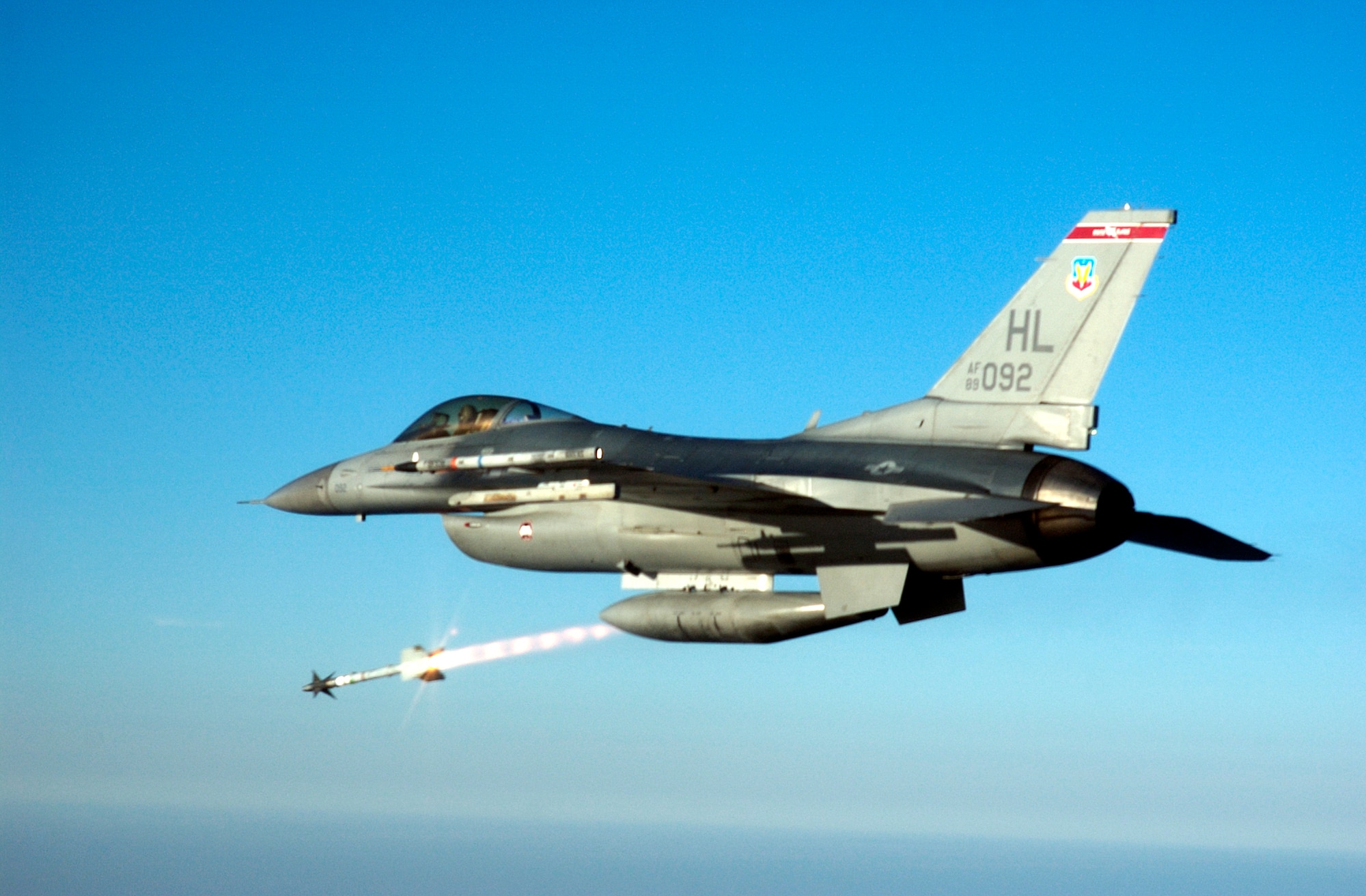 OVER THE GULF OF MEXICO -- Capt. Steve Boatright, an F-16C Fighting Falcon pilot, fires an AIM-9M Sidewinder heat-seeking missile at an aerial target drone over the Gulf of Mexico.  Captain Boatright is assigned to the 34th Fighter Squadron at Hill Air Force Base, Utah.  The squadron recently deployed to Tyndall AFB, Fla., to fly air-to-air weapons testing missions.  (U.S. Air Force photo by Master Sgt. Michael Ammons)