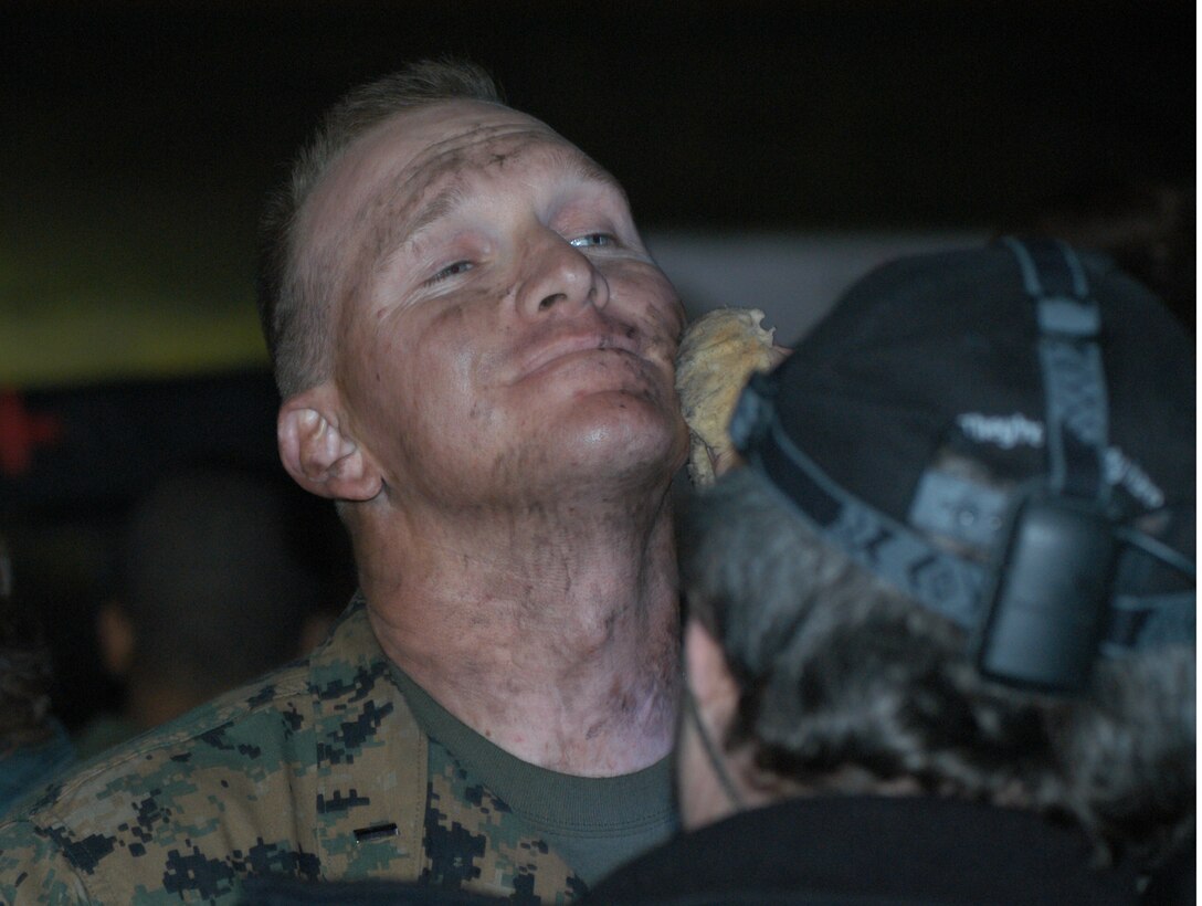 While awaiting an upcoming battle scene involving the Marines combating the "aliens", a make-up artist applies the finishing touches to 1st Lt. Clay P. Bringhurst, executive officer for Delta Company, 1st Light Armored Reconnaissance Battalion, 1st Marine Division.