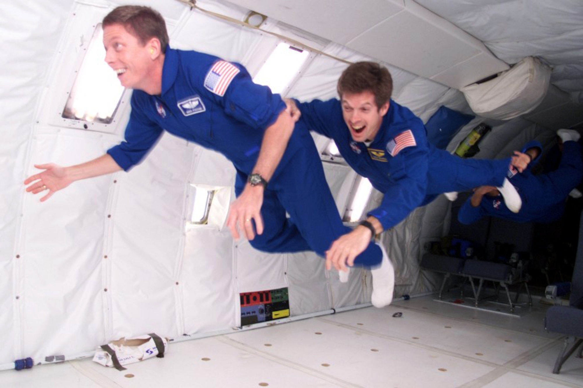 HOUSTON -- Lt. Col. Michael Fossum (left) and fellow astronaut Steven Swanson train inside a specially built KC-135 Stratotanker at NASA's Johnson Space Center here for an upcoming mission.  During initial astronaut training, the modified aircraft is used to test tools and basic techniques in moving around in zero gravity.  Colonel Fossum is a reservist assigned to the F-16 system program office at Wright-Patterson Air Force Base, Ohio.  (Courtesy photo)
