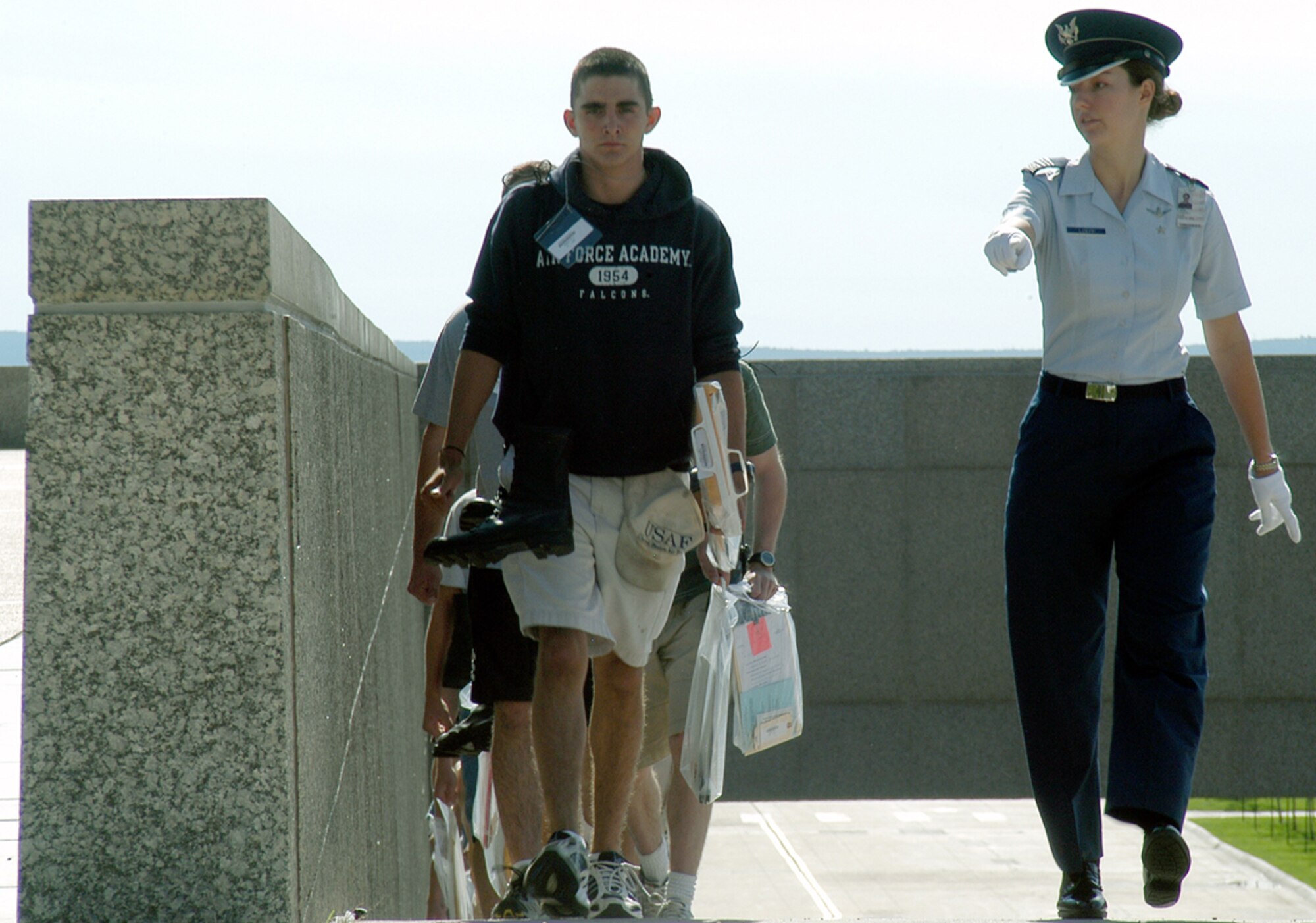 U.S. AIR FORCE ACADEMY, Colo. -- Cadet 1st Class Jessica Loepp (right) delivers pointed commands to Basic Cadet Chad Rudolph as they march up the main ramp to the terrazzo here July 1.  A new group of more than 1,300 appointees began their Air Force careers by enrolling in the Class of 2008.  (U.S. Air Force photo by Tech. Sgt. James A. Rush)