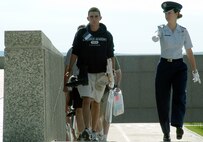 U.S. AIR FORCE ACADEMY, Colo. -- Cadet 1st Class Jessica Loepp (right) delivers pointed commands to Basic Cadet Chad Rudolph as they march up the main ramp to the terrazzo here July 1.  A new group of more than 1,300 appointees began their Air Force careers by enrolling in the Class of 2008.  (U.S. Air Force photo by Tech. Sgt. James A. Rush)