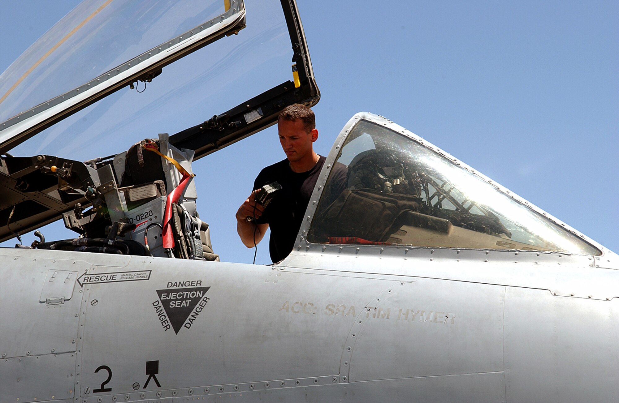 BAGRAM AIR BASE, Afghanistan -- Airman 1st Class Jesus Rodriguez prepares an A-10 Thunderbolt II for takeoff, just before a pilot gets into the aircraft.  Airman Rodriguez is a 455th Expeditionary Aircraft Maintenance Squadron crew chief.  (U.S. Air Force photo by Master Sgt. Andrew Gates)
