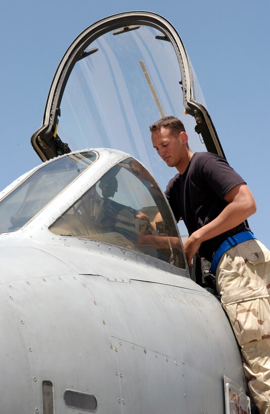 BAGRAM AIR BASE, Afghanistan -- Airman 1st Class Jesus Rodriguez prepares an A-10 Thunderbolt II for takeoff, just before a pilot gets into the aircraft.  Airman Rodriguez is a 455th Expeditionary Aircraft Maintenance Squadron crew chief.  (U.S. Air Force photo by Master Sgt. Andrew Gates)