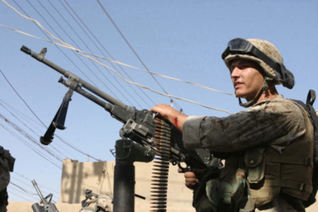 A Marine readies his weapon after an attack on the Iraqi police station in Al Kharma, Iraq, on June 8, 2004. The 1st Marine Division is engaged in Security and Stabilization Operations in the Al Anbar Province of Iraq in support of Operation Iraqi Freedom. 