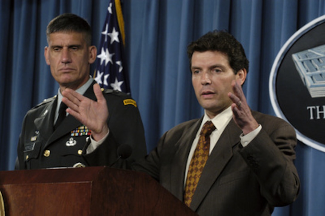 Principal Deputy Assistant Secretary of Defense for Public Affairs Lawrence Di Rita responds to a reporter's question during an operational update at the Pentagon on July 8, 2004. Di Rita is joined by Joint Staff Deputy Director of Operations Brig. Gen. David Rodriguez, U.S. Army. 