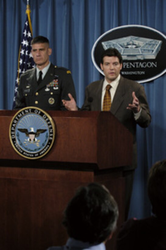 Principal Deputy Assistant Secretary of Defense for Public Affairs Lawrence Di Rita responds to a reporter's question during an operational update at the Pentagon on July 8, 2004. Di Rita is joined by Joint Staff Deputy Director of Operations Brig. Gen. David Rodriguez, U.S. Army. 